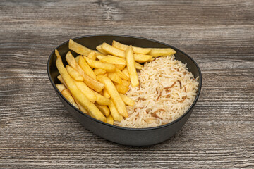 The shadows cast by the pile of fries create a play of volumes and textures on the white marble surface in the background