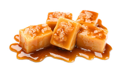 Tasty candies with salt and caramel sauce isolated on white
