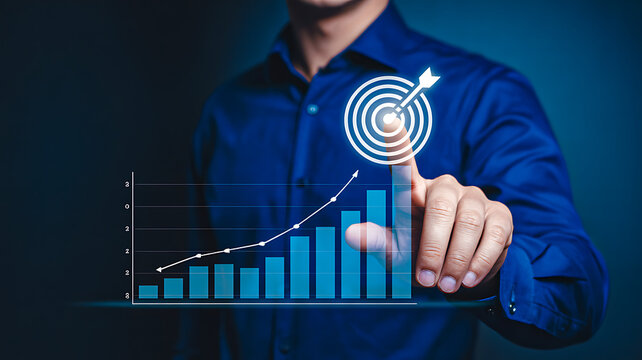 Person pointing at digital target icon with upward bar and line graph symbolizing goal achievement and business growth - Powered by Adobe