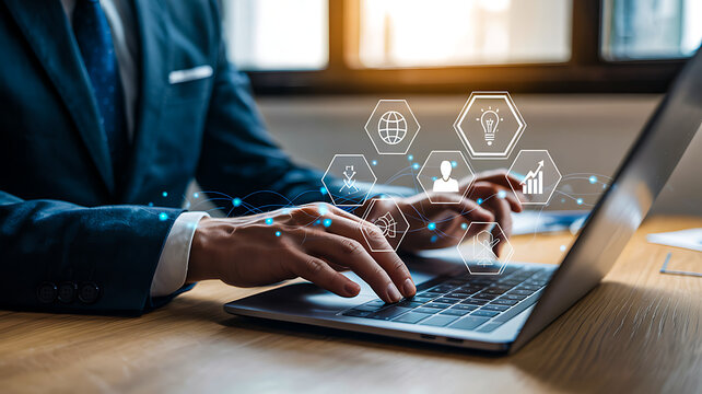 Business professional typing on laptop with floating tech icons symbolizing innovation, global connectivity and digital transformation
