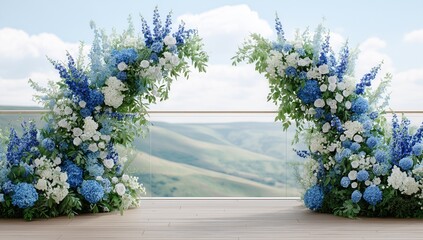 A large archway of flowers is on a wooden deck