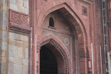 Vertical Closeup of Mughal Sandstone Arch with Decorative Carvings
