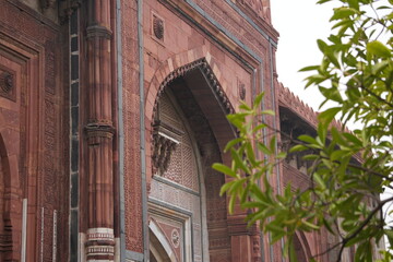 Tall Mughal Doorway with Arched Frame in Red Sandstone Walls