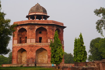 Red Sandstone Mughal Pavilion Surrounded by Lush Greenery