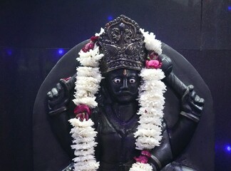 Shani Dev Stone Idol with Blue Decorative Lights