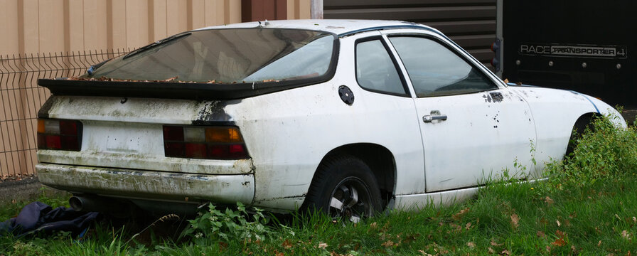 Germany, Sennelager, November 14. 2025, old, no longer roadworthy white Porsche 924, a sports coupe that was produced between 1976 and 1988