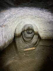 The tunnel is flooded with water. The mine is divided into a light and dark side