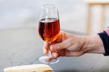 Hand holding oloroso sherry catavino glass in jerez