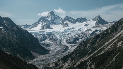 Fototapeta premium Snow-capped mountains and glaciers in a rugged alpine landscape. Majestic peaks and icy terrain in a remote mountain range. The scene of high-altitude glacial valleys and rugged terrain.