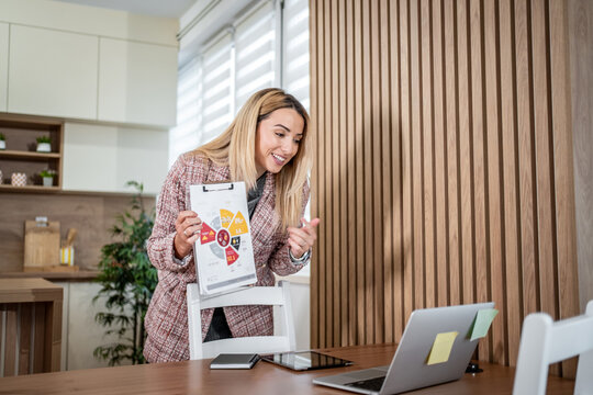 Businesswoman presenting data chart during online video call meeting