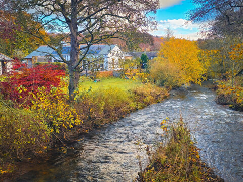 Autumn Beauty in The Howk Limestone Gorge with Waterfall and Historic Ruins