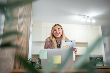 Woman presenting business data during video conference call