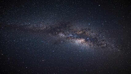 Obraz premium A view of the night sky with stars and the Milky Way galaxy.