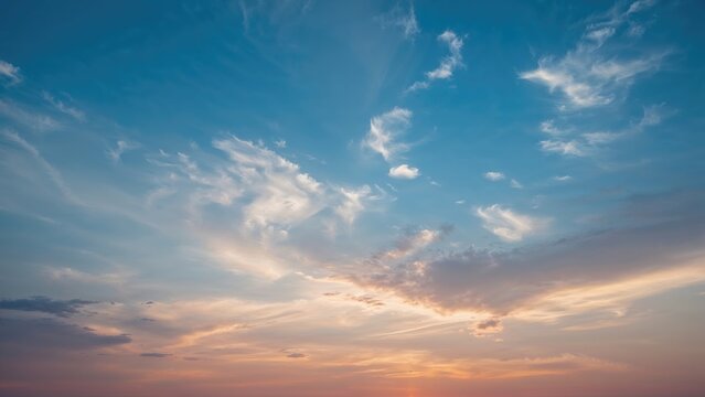 Cloudy sky at sunset with soft sunlight and scattered clouds. Nature and weather scene. Tranquil and beautiful sky. - Powered by Adobe