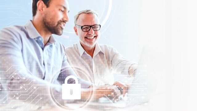 Cheerful web developers working on a laptop