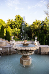 A classical stone fountain with flowing water in the central cascade of Valea Morilor Park in Chisinau, Moldova. 