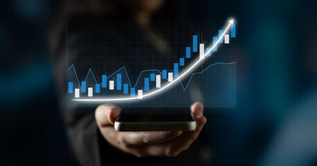 A woman holds a smartphone displaying a financial graph that highlights an upward trend, symbolizing growth in the stock market and advanced data analysis. Impute