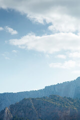 Serene Mountain Ridge Under Blue Sky With Soft Clouds and Dawn Light