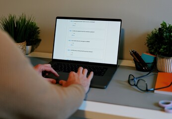 Middle Aged Man Working Remotely From Home Conducting Cybersecurity Audit for Consulting Firm - Information Security Concept