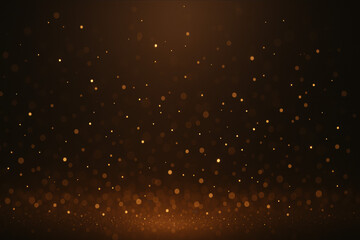 Warm glowing golden particles floating on a dark background creating a soft festive bokeh effect
