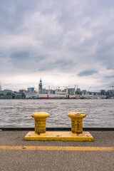 Elbe River with yellow bollards in the foreground