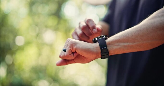 Hands, man outdoor and smart watch with workout app, tracking heart rate and fitness progress. Bokeh, space or person scroll with tech in nature for exercise results, wellness update or step counter.