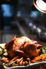Christmas dinner plate featuring roasted turkey with root vegetables, Brussels sprouts, mashed potatoes, green beans, carrots, fresh salad, plus classic sides like stuffing, gravy and cranberry sauce.