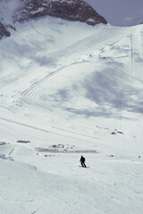 Skiers Riding Down the Mountain on a Sunny Winter Day