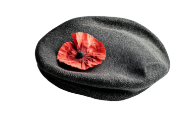 Military beret with poppy tucked inside cloth symbolizing honor and remembrance of service