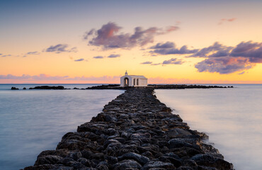 Sunset over the rocky path to the church in Agios Nikolaos, Crete