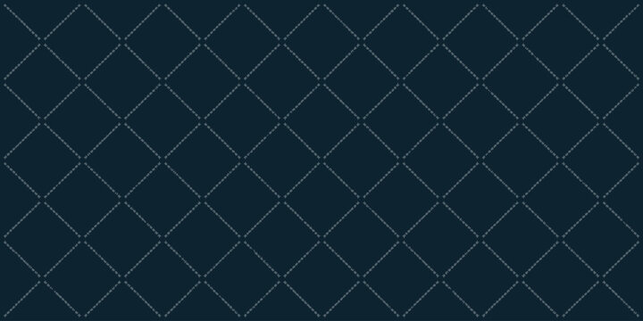 Dark blue quilted fabric with diamond pattern and faint white stitching running along the lines
