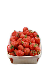 A Small Wooden Punnet Full Of Ripe Red Strawberries, Isolated On A White Background, A Concept Of Summer Fruit Harvest.