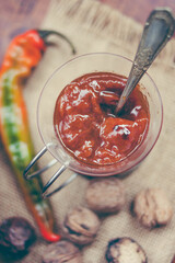 Spicy Sauce and Ingredients: Chili, Walnuts, and Paprika Still Life   