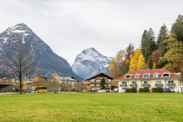 ChatGPT said:
Picturesque autumn scene in Scholastika near Lake Achensee: alpine houses, colourful foliage and a wide meadow beneath snow-capped peaks—peaceful Tirol village charm and mountain beauty