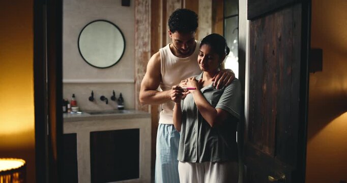 Smile, couple and reading pregnancy test at house with positive results, support and ivf success. Happy, people or morning embrace with fertility kit, good news and pregnant partner for future family