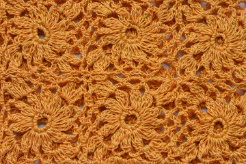 Lace seamless pattern with flowers. Art background, wallpaper pattern. Orange lace seamless with floral design. Handmade knitted texture.