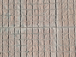 Fondo de textura de baldosas de pavimento cuadradas con micro patrón de rectángulos en color terracota