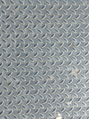 Fondo de textura de placa de metal estriada gris con patr&oacute;n antideslizante de diamante