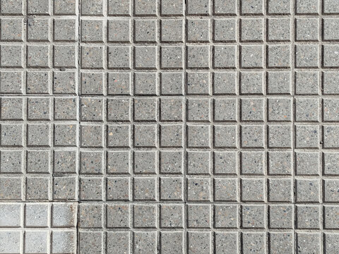 Fondo de textura de pavimento de adoquines cuadrados de hormig&oacute;n gris visto desde arriba