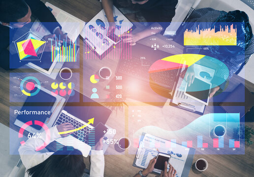 A modern workspace featuring data visualization tools and charts. Team members collaborate on digital reports, enhancing analysis and planning. Impute - Powered by Adobe