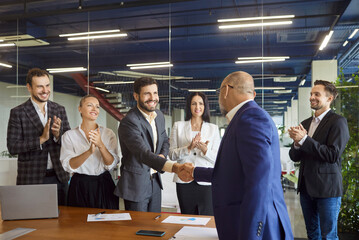 Business people shaking hands on meeting in conference room, applause of happy team of office...