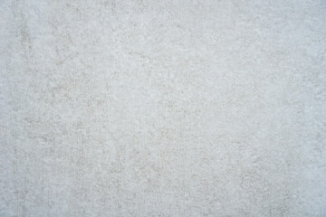 light grey abstract background texture closeup detailed surface with small specks and subtle lines concept of construction material, wallpaper, backdrop