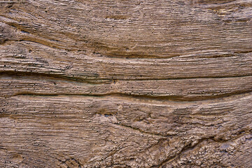 Fototapeta premium detailed brown wood texture closeup with horizontal grain and intricate lines concept of carpentry, construction, wallpaper