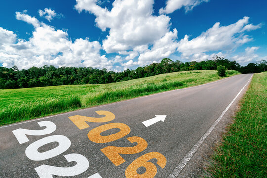 2026 New Year road trip travel and future vision concept . Nature landscape with highway road leading forward to happy new year celebration in the beginning of 2026 for glee and successful start .
