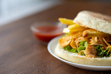 Close-Up of Turkish Chicken Doner Served with French Fries in Bread
