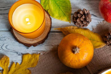 Cozy Autumn Still Life with Candle and Pumpkin