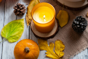 Cozy Autumn Still Life with Candle and Pumpkin