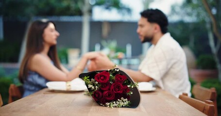 Love, bouquet or couple in restaurant with hand holding, gift or bonding together in anniversary celebration. Honeymoon, man or woman in relationship with rose, present or affection in romantic date. - Powered by Adobe