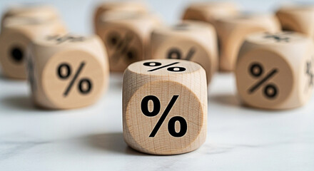 Wooden dice featuring percentage symbols represent interest rates and financial concepts in a macro studio shot for business and investment themes