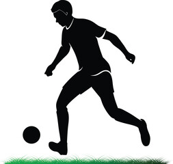 Silhouette of a soccer player kicking a ball outdoors